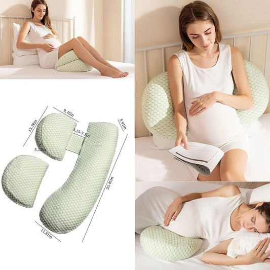 Pregnant maternity pillow set shown in a collage: three views of the pillow on a bed, a large dimension diagram, and a woman sleeping while holding a baby against the pillow. The pillow is light sage green with a textured honeycomb pattern.